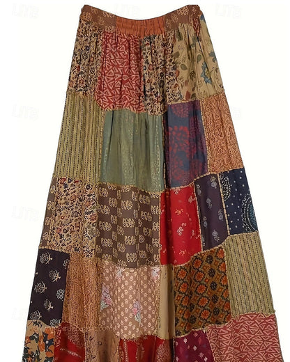 Falda larga boho para mujer, de estilo casual, tiro medio, con estampado floral y ligera elasticidad. Perfecta para vacaciones o street style. Disponible en rojo y azul, ideal para verano, confeccionada en poliéster.